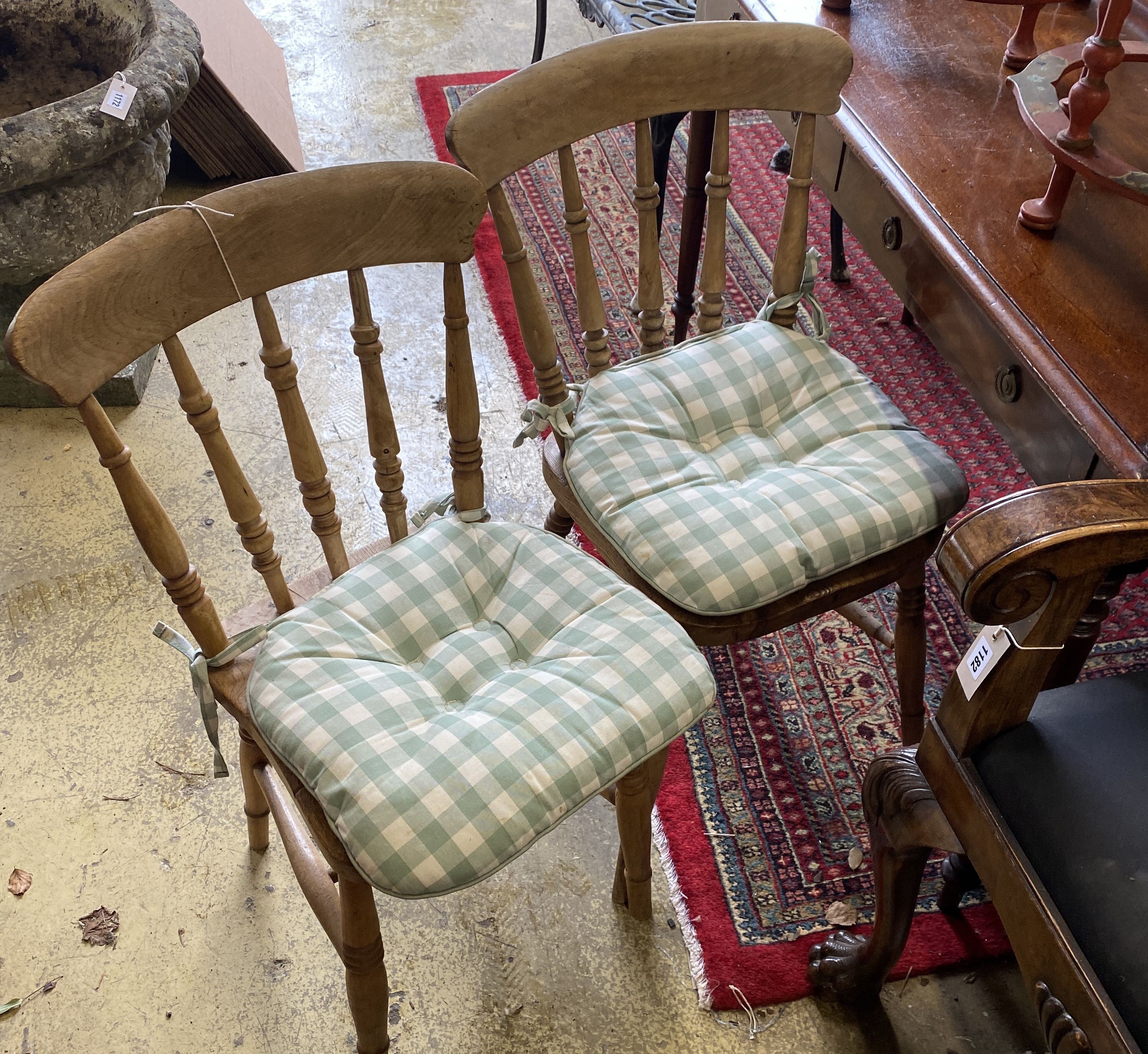 A harlequin set of eight Victorian elm and beech Windsor kitchen dining chairs